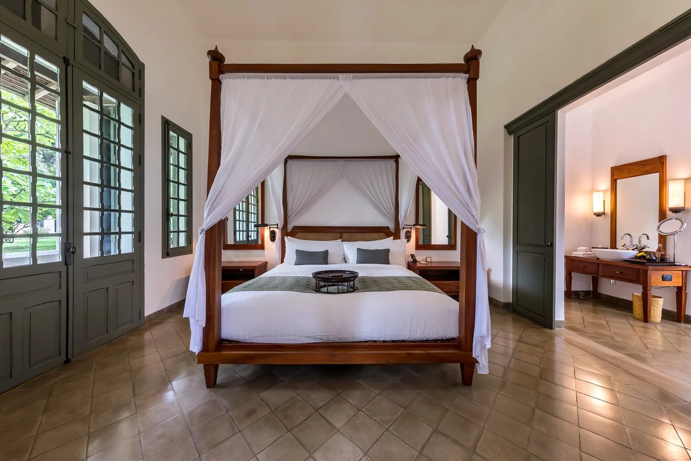 Elegant hotel suite with a four-poster bed